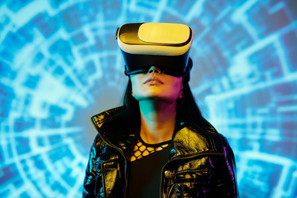 A woman using a VR headset immersed in a digital virtual reality environment.